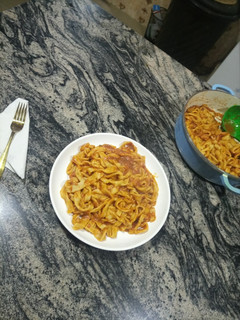 A picture of Fresh Noodles with Ragu sauce.