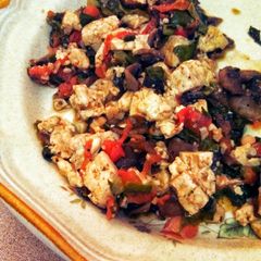 A picture of Sauteed mushrooms with kale and tofu.