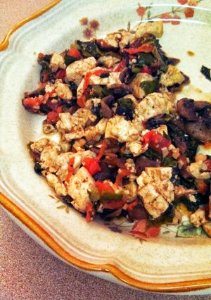 A picture of Sauteed mushrooms with kale and tofu.
