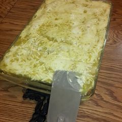 A picture of Green chicken enchiladas.
