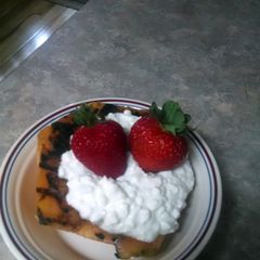 A picture of Grilled Cantaloup with cottage cheese.