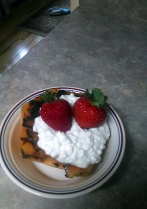 A picture of Grilled Cantaloup with cottage cheese.