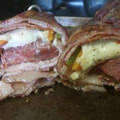 A picture of Smoked Pork Tenderloin Italian Bacon Bomb.