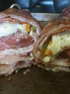 A picture of Smoked Pork Tenderloin Italian Bacon Bomb.