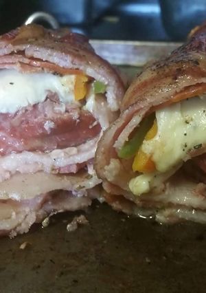 A picture of Smoked Pork Tenderloin Italian Bacon Bomb.