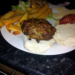 A picture of grilled white onion beef burgers.