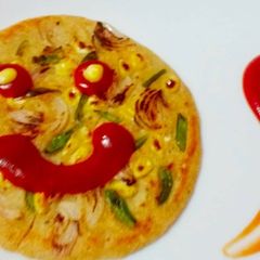 A picture of Vegetables Oats Corn Uttapam.