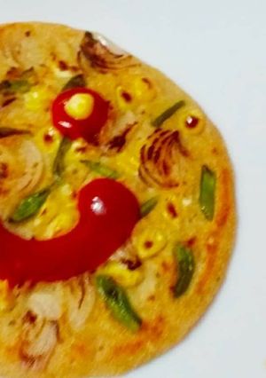 A picture of Vegetables Oats Corn Uttapam.