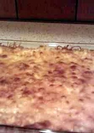 A picture of loads of cheese baked mac n cheese.