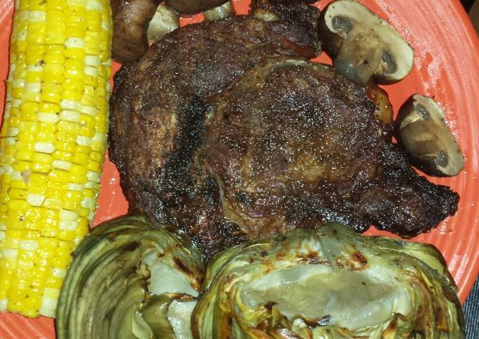 Ribeye steak w/corn, bbq mushrooms, bbq artichokes