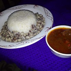 A picture of Rice and Beans with stew.