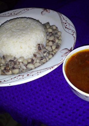 A picture of Rice and Beans with stew.