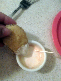 A picture of Fried pickles with dipping sauce.