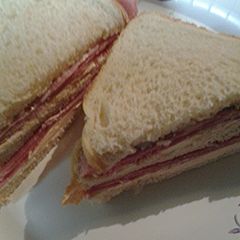 A picture of Ham and smoked salmon cream cheese sandwich.