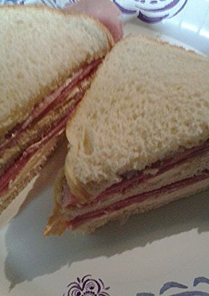 A picture of Ham and smoked salmon cream cheese sandwich.