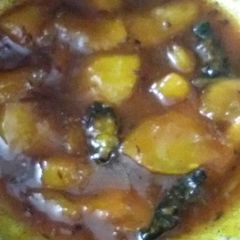 A picture of Raw mango launji in jaggery.