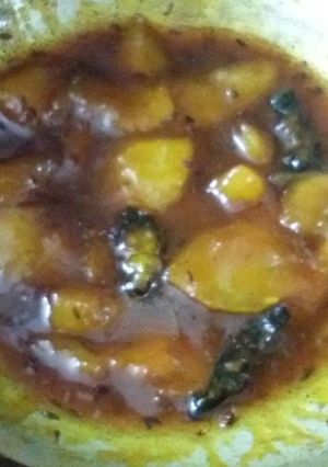 A picture of Raw mango launji in jaggery.