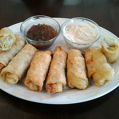 A picture of Crab and Artichoke egg rolls.