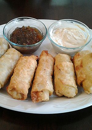 A picture of Crab and Artichoke egg rolls.