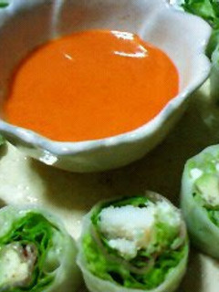 A picture of Fresh Spring Rolls with a Delicious Sauce.