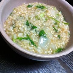A picture of Brown Rice Porridge with the Seven Herbs of Spring.
