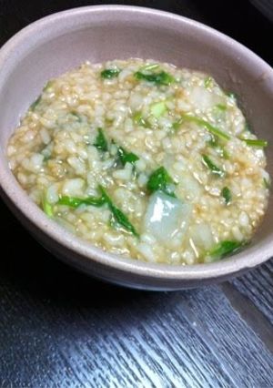 A picture of Brown Rice Porridge with the Seven Herbs of Spring.