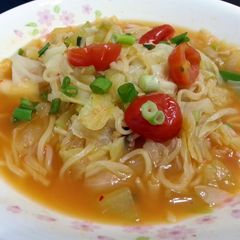 A picture of Cabbage And Tomato In Noodle Soup.