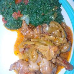 A picture of Chicken stew with pumpkin leaves.