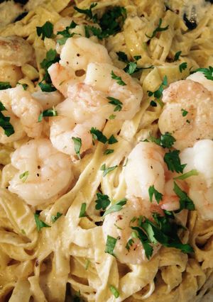 A picture of Creamy Pasta Alfredo With Shrimp Scampi.