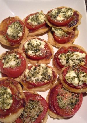 A picture of Tomato tart with goat cheese & pesto.