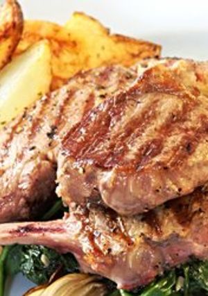 A picture of Oven-Baked Lamb Chops with Potatoes.