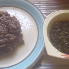 A picture of Amala and bitter leaf soup.