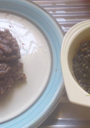 A picture of Amala and bitter leaf soup.
