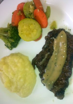 A picture of chicken or meat steak sauce (topping).