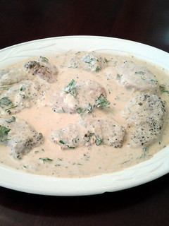 A picture of Pork Medallions in a Mustard Apple Brandy Green Peppercorn Sauce.