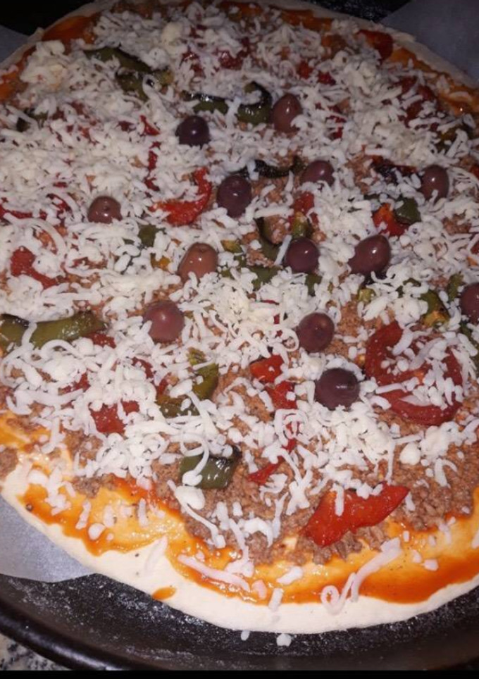 Una foto de Masa de pizza casera🍕y preparación de pizza 2*1