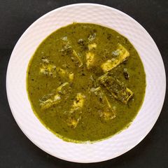 A picture of Paneer in Green curry (methi chaman).