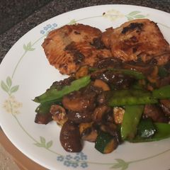 A picture of Soy glazed salmon with mushrooms and veggies.