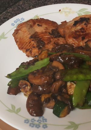 A picture of Soy glazed salmon with mushrooms and veggies.