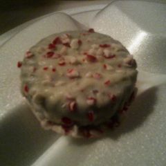 A picture of White Chocolate Dipped Oreos with Peppermint Crunchies.