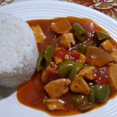 A picture of Chicken sashlik with white rice.
