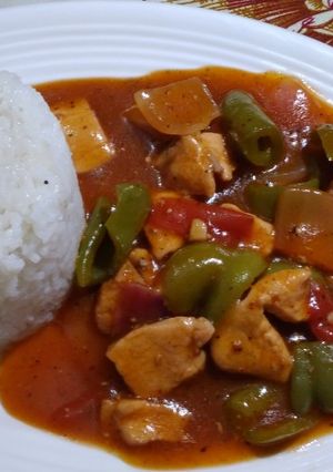 A picture of Chicken sashlik with white rice.