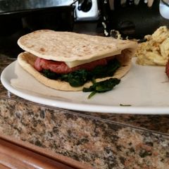 A picture of Sausage spinach sandwich.