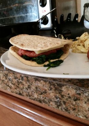 A picture of Sausage spinach sandwich.