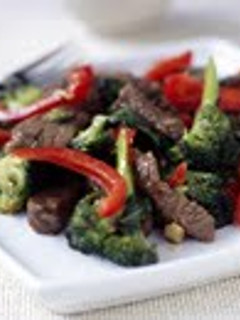 A picture of Beef, red pepper and mushroom stirfry.