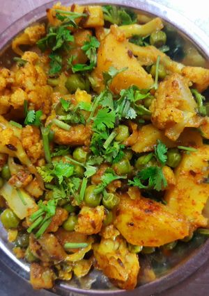 A picture of Aloo Gobi Matar (Potato, Cauliflower, and Pea Curry).