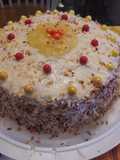 Pineapple filled toasted coconut yellow rum cake.