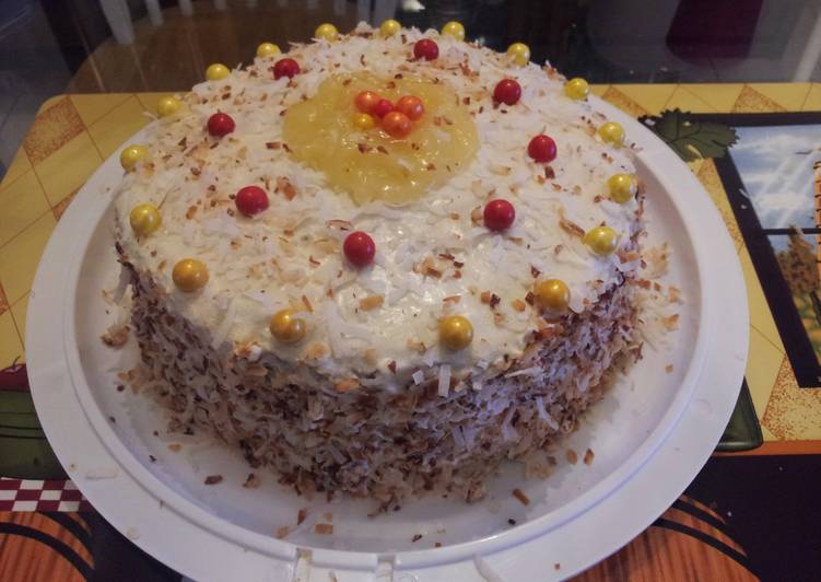Pineapple filled toasted coconut yellow rum cake.