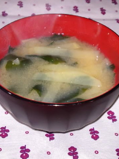 A picture of Miso soup with thinly cut potato.