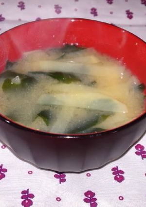 A picture of Miso soup with thinly cut potato.